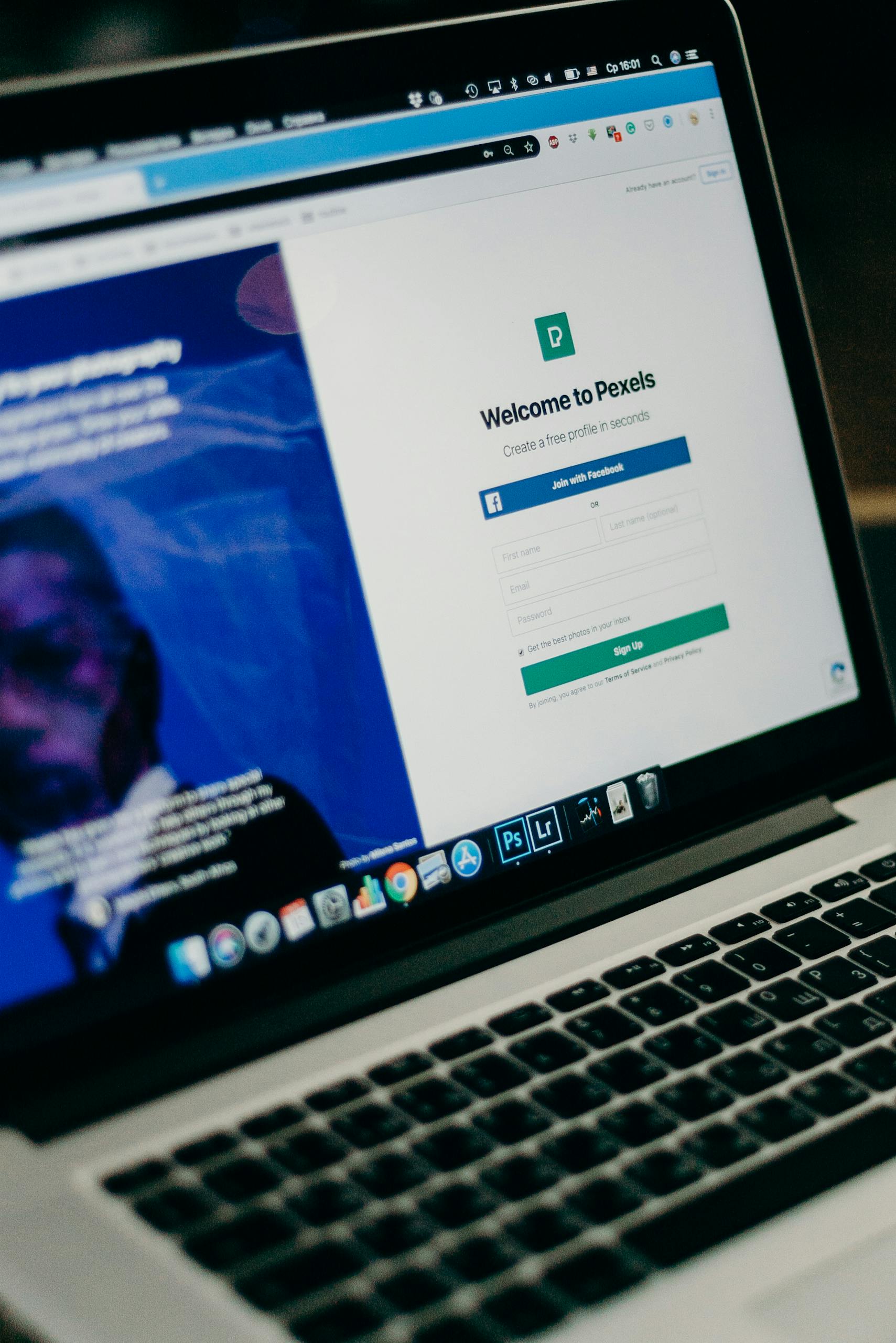 Home 17 Close-up view of a laptop displaying a sign-up page for an online platform.